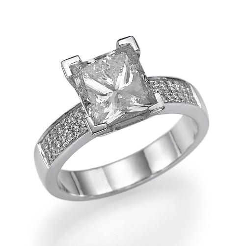 Elegant silver ring featuring a large, square-cut central gemstone accented with a pave of sparkling stones along the band.