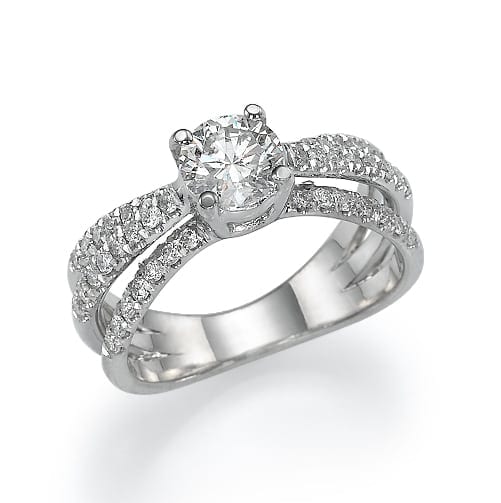 An elegant silver ring featuring a prominent central diamond flanked by bands of smaller glittering stones.