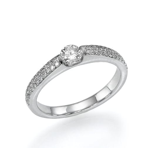 Elegant silver ring featuring a central round-cut diamond with a pavé setting along the band.