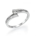 An elegant silver ring featuring a central round-cut diamond embraced by a sparkling band with pavé-set diamonds.