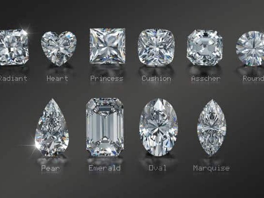 A collection of various diamond shapes with labels including radiant, heart, princess, cushion, asscher, round, pear, emerald, oval, and marquise, displayed against a dark background.