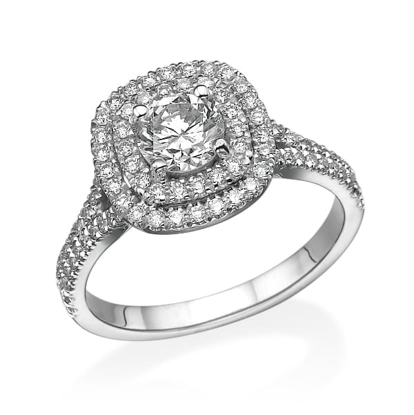 טבעת אירוסין מסנוורת בטבעת דגם Katia הכוללת אבן מרכזית גדולה מוקפת הילה כפולה של יהלומים קטנים יותר, משובצת על רצועת כסף משובצת ביהלומים נוספים.