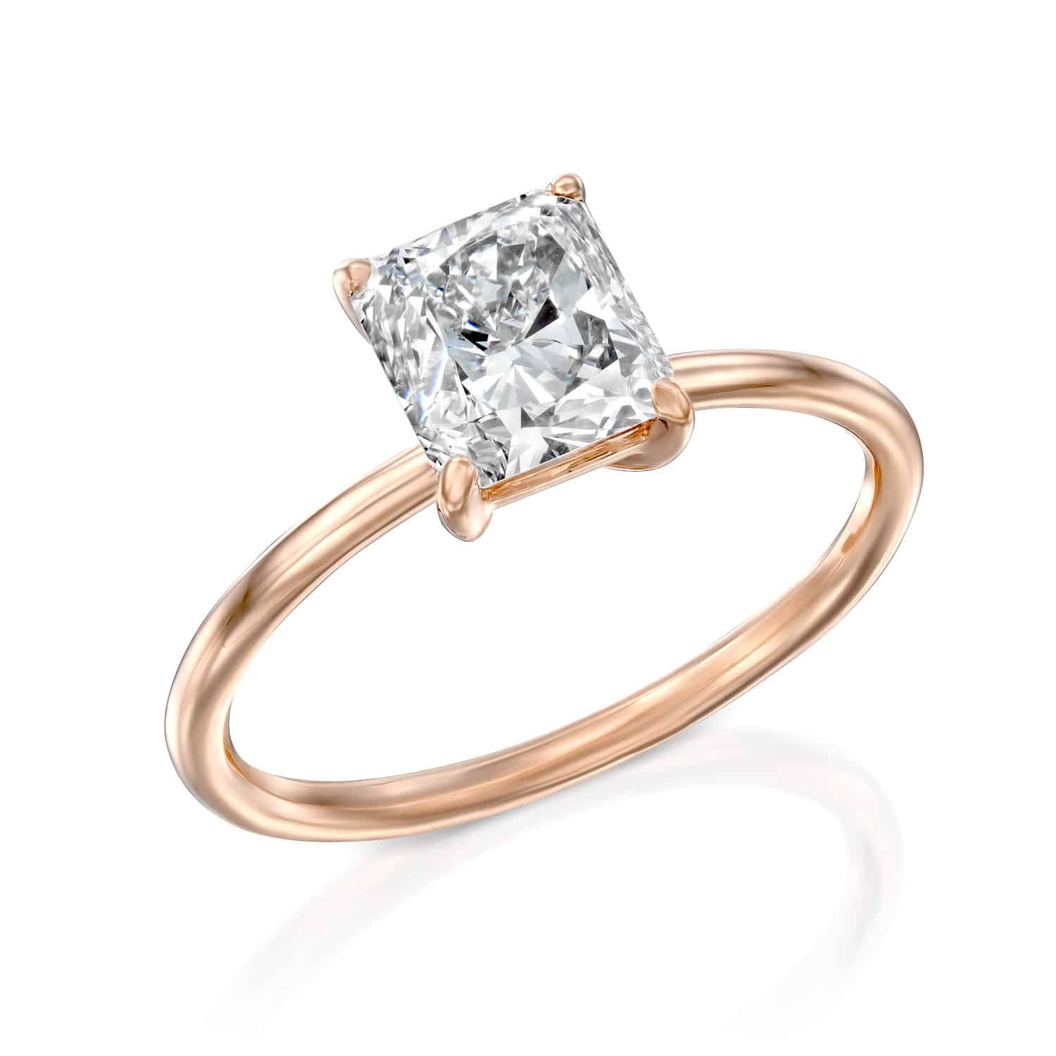טבעת זהב ורדרד אלגנטית הכוללת יהלום יחיד בחיתוך קורן משובץ בעיצוב סוליטר קלאסי.